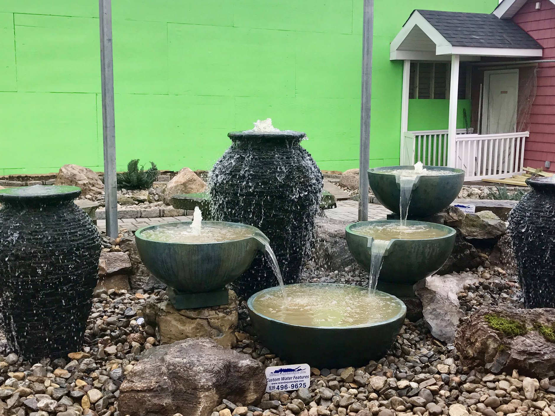 two urns with 4 spillway bowls pouring into each other